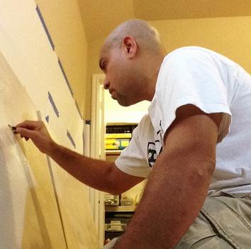 Artist Sebastian Marquez drawing in his studio