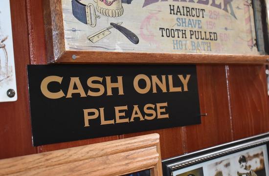 Sign that says "CASH ONLY PLEASE".