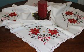 Christmas table toppers and table runners provide instant holiday decorations