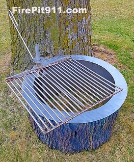 alt="tree stump fire pit with grill "