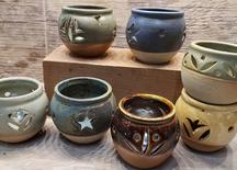 Candle cups Assorted Colors and Carvings $24 2.5'' x 3''