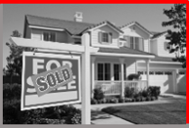 a residential home with a sold sign on lawn