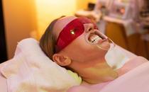Teeth whitening in a serene setting on a massage table in a skin care room