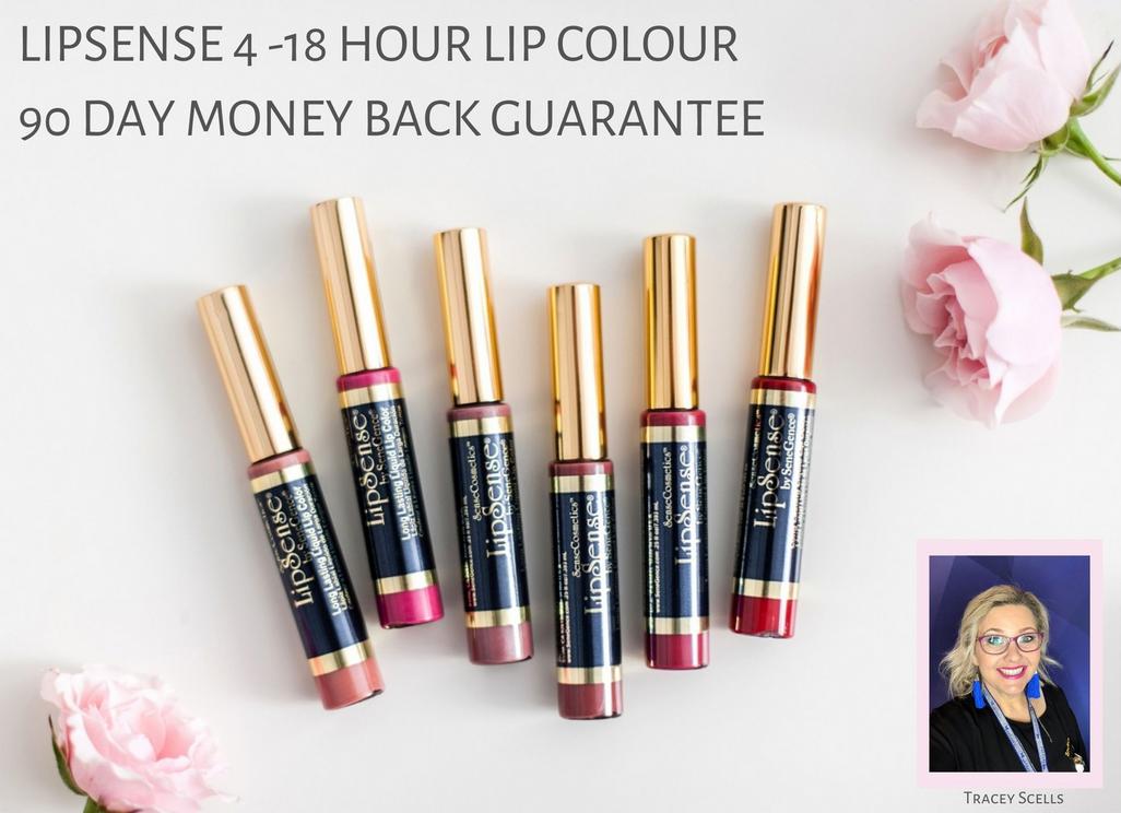 6 LipSense Lip Colors of pink, brown, mauve and reds on white background with pink roses on the right hand side, and text of 'LipSense 4 - 18 Hour Lip Colour 90 Day Money Back Guarantee' and photo of Tracey Scells wearing glasses with blonde hair out in bottom right hand corner.