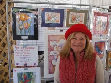 Charlene Jenner displaying her paintings at an art show in Long Beach, Mississippi