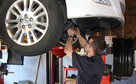 auto technician working on car