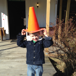 Colby's Army photo of a boy with a yellow traffic cone on his head