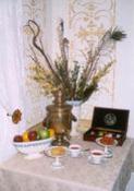 Hot and cold beverages, just-baked cookies, hard candies and fruit are available throughout the day. Table in front parlor with fruit, candies, flowers