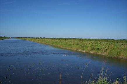 St Johns Improvement District primary canal (flowway) with a clear blue sky