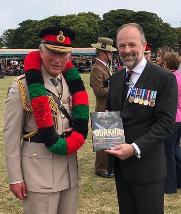 HRH Prince Charles with Craig Lawrence at the Regimental Launch of the new Gurkha RGR25 book