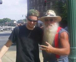 Colby's Army photo of Colby Keegan doing homeless outreach, with homeless man