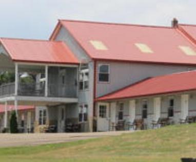 alt="Front Of Building with Room Doors Level to Parking Lot"