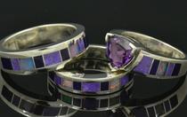 Sugilite and opal engagement and wedding ring set.