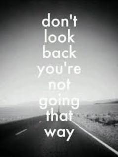 Black and white photo of a open road with caption "Don't look back you're not going that way"