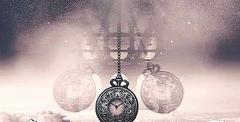 Image of antique silver pocket watch dangling left to write with hue of browning smoke and ocean in the background