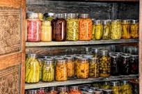 Shelves full of food in glass jars