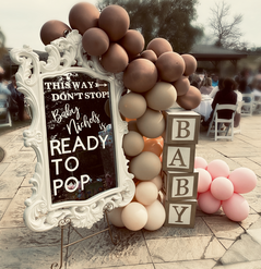 Ready to Pop Baby Shower welcome sign with boho balloon garland and baby blocks