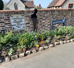Picture of church wall and coronation stone