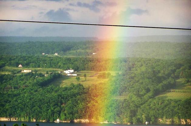 alt="Seneca Lake Hillside with Bright Rainbow"