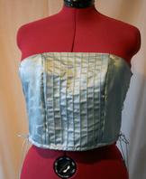 Pale blue corset with pin tuck design. Side opening.