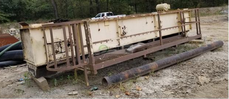 Used Equipment: Transfer Conveyor Missing Chain & Slats, Missing Gearbox, Missing Head Shaft & Sprockets Has 3' Catwalk on one side 3'7" Wide OD, 3' Deep, 3' ID 30HP Motor with 1775 RPM motor Customer may have all parts