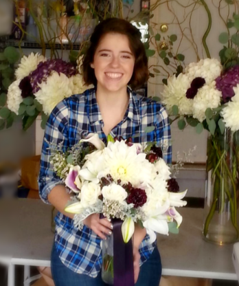 Head florist holding a lovely bouquet of flowers.