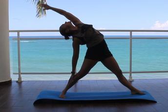 Female performing stretching exercises to improve flexibility and general fitness