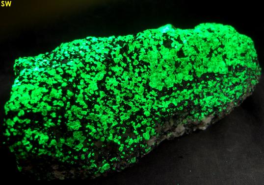 fluorescent green WILLEMITE, FRANKLINITE, CALCITE, ZINCITE - Franklin Mine, Franklin, Franklin Mining District, Sussex County, New Jersey, USA - Franklinite and Zincite type locality