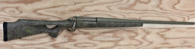 Remington action, Broughten barrel, Jewell trigger, PCS Custom thumbhole stock and Cerakote making up a custom Remington 260 Match on a wood background