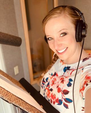 Haley, a talented voice over artist, in her home studio
