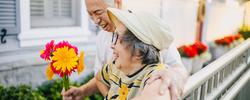 Elderly couple embracing and laughing