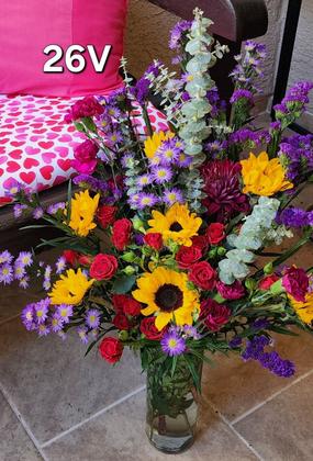 Colorful yellow, blue, grey and red beautiful flower vase for valentine's day in Helotes TX with miniture sun flowers and baby small red roses and grey eucalyptus