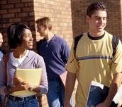 Image of high school students outside a school building