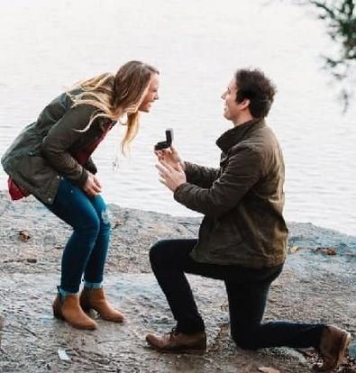 Man on one knee proposing, after his lover purchased and successfully used this Make partner ask me to marry Powerful engagement spell.