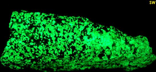 fluorescent green WILLEMITE, FRANKLINITE, CALCITE, ZINCITE - Franklin Mine, Franklin, Franklin Mining District, Sussex County, New Jersey, USA - Franklinite and Zincite type locality