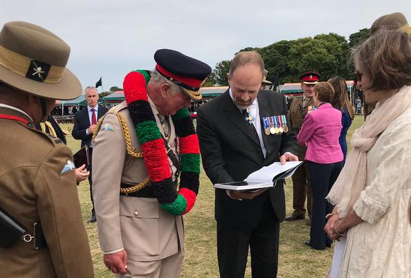 Craig Lawrence and Laura Lawrence discussing the new Gurkha book with Prince Charles
