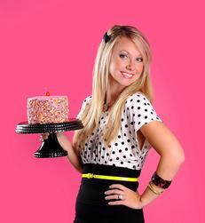 Alyssa shows off a pretty pink cake with sprinkles