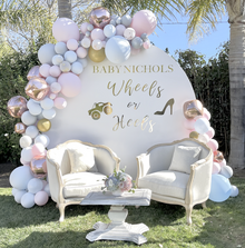 Gender reveal balloon backdrop wheels or heels party