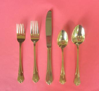 Vintage gold flatware place settings for wedding rentals at Rent Your Event, LLC in Charlotte, NC.