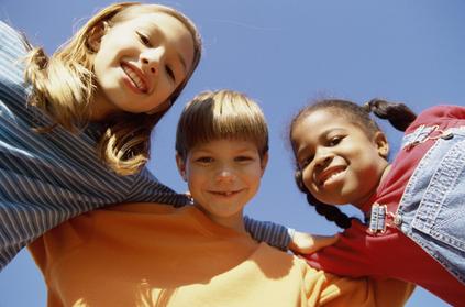 Image of three children smiling