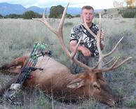 Whitetail deer hunter with bow