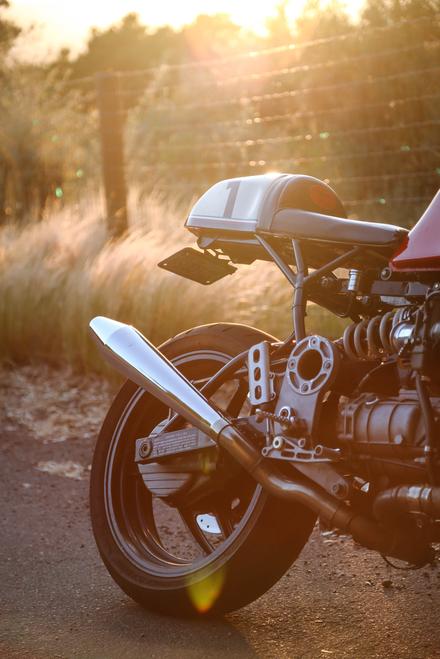 cafe racer motorcycle with napa valley forest lifestyle sunset