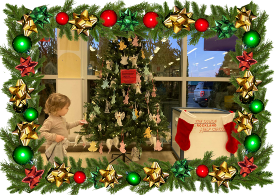 Image of child in front the angel tree