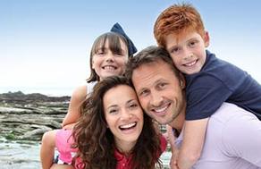 smiling family on beach