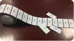 Fenotags on Reel for Auto Inserting Laundry Tags - save time and labor