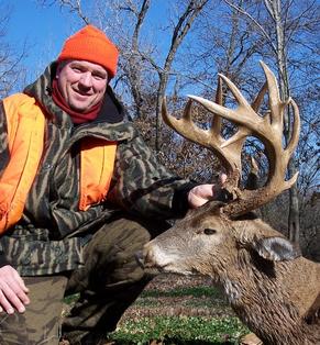 Whitetail deer hunter with bow