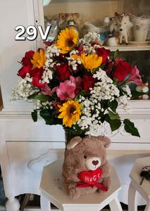 Helotes texas floral vase with colorful blend of orange daisies, deep red roses, white button mum and a soft plushy teddy bear for valentines day