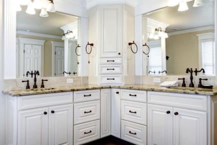 Photo of twin vanities with custom mirrors