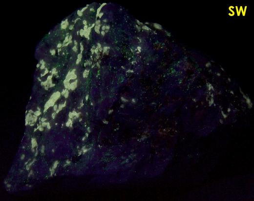 fluorescing FLUOBORITE, CHONDRODITE, PYRITE, CALCITE - Lime Crest Quarry (Lime Crest-Southdown Quarry), Sparta Township, Sussex County, New Jersey, USA