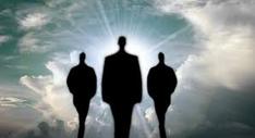 Black silhouette of 3 men walking towards the heavenly sky